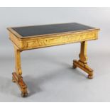 An early Victorian birds-eye maple writing table, by Holland & Sons, with tooled black leather