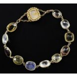 A late Victorian gold and multi gem set bracelet, set with eleven mainly oval cut stones including
