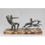 Michel Decoux. An Art Deco bronze group of an archer and two deer, on marble plinth, width 19.5in.