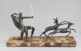 Michel Decoux. An Art Deco bronze group of an archer and two deer, on marble plinth, width 19.5in.