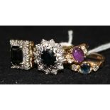 Three assorted 18ct gold and gem set dress rings and a similar 14ct gold ring.