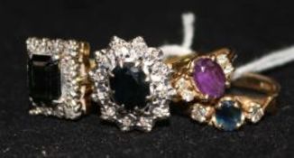 Three assorted 18ct gold and gem set dress rings and a similar 14ct gold ring.