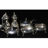 A matched silver six piece condiment set.