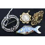 Two brooches, an enamelled articulated fish and a paste brooch.