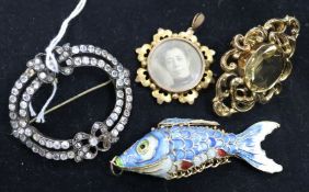 Two brooches, an enamelled articulated fish and a paste brooch.