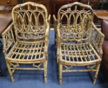 A set of four bamboo elbow chairs
