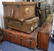 A group of four suitcases and a hat case