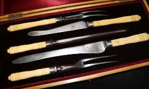 A Victorian cased five piece ivory handled carving set.