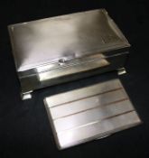 A silver cigarette case and a silver cigarette box.