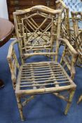 A set of six rattan elbow chairs