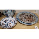 An 18th century Chinese blue and white dish, 34cm and two Imari bowls and a dish, 19.5-27cm (4,