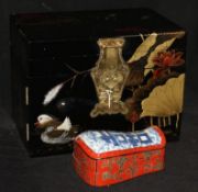A Japanese lacquered jewellery cabinet and a Chinese lacquered box in the form of a pillow