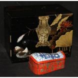 A Japanese lacquered jewellery cabinet and a Chinese lacquered box in the form of a pillow