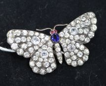 An early 20th century silver and paste set butterfly brooch, 1.75in.