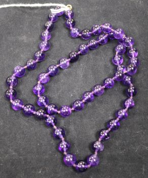 A single strand amethyst bead necklace, 26in.