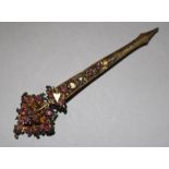 A gilt metal and pink stone set brooch, 4in.