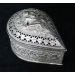 A Burmese silver teardrop shaped box with pierced cover containing minor items of jewellery.