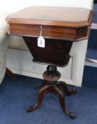 A Victorian rosewood work table, with silk box and foliate carved base, H.72cm