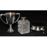 An Edwardian silver and tortoiseshell trinket box, a silver top bottle and a small silver trophy