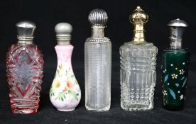 A collection of five silver and other top scent bottles