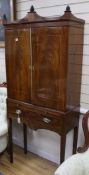 A Regency style mahogany cabinet on stand, W.82cm H.190cm