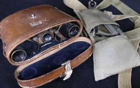 A pair of German WWI binoculars, two helmet straps and four pairs of Africa core goggles