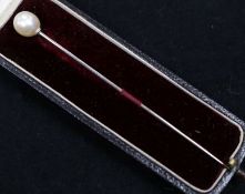 A cultured pearl set stick pin, in Goldsmiths & Silversmiths box.