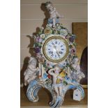 A late 19th century Thuringian porcelain mantel clock, encrusted with flowers, mounted with