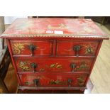 A miniature Chinese red lacquer cabinet, W.51cm