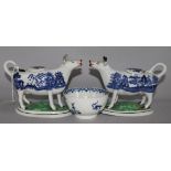 A pair of Staffordshire Willow pattern cow creamers and a Worcester blue and white tea bowl