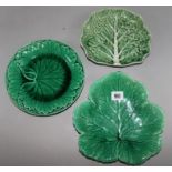 A collection of green leaf plates and dishes