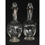 A pair of silver mounted decanters