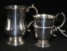 A late Victorian silver christening cup and a later silver mug.