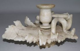 An alabaster candle holder