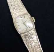 A lady's 1970's 9ct gold Omega manual wind wrist watch.