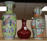 Two large 19th century Chinese famille rose vases and a sang-de-boeuf vase, H 32-58cm (3, all