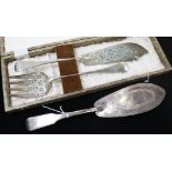 A George III silver fish slice, London 1802 and a pair of Victorian silver fish servers, cased