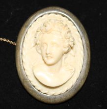 A horn mounted carved ivory cameo brooch, 2in.