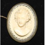 A horn mounted carved ivory cameo brooch, 2in.