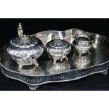 A three piece plated tea set and a shaped oval gallery tray.