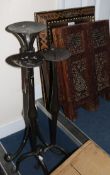 A Moorish mirror, a table and iron candlesticks