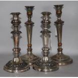 Two pairs of plated candlesticks