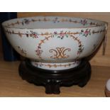 A 19th century Chinese export punch bowl (restored), on carved hardwood stand