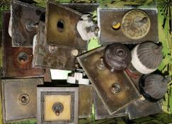 A collection of 1920s-30s light switches