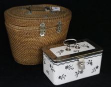 A Chinese teapot in wicker case and a ceramic sandwich box