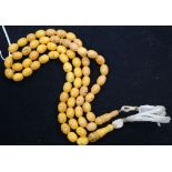 Two single strand amber bead necklaces, gross 36 grams.