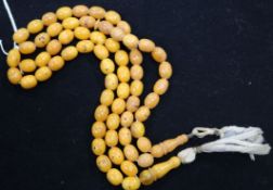 Two single strand amber bead necklaces, gross 36 grams.