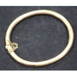 An early 20th century 15ct gold plain hinged bangle.