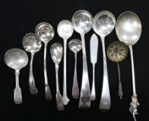 A George II silver apostle spoon (marks rubbed) and a collection of small silver sauce ladles,