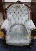 A pair of Victorian rosewood buttoned armchairs